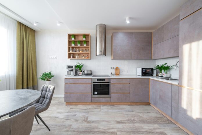 Modern kitchen with durable tile flooring, showcasing one of the best kitchen flooring options for style and longevity.