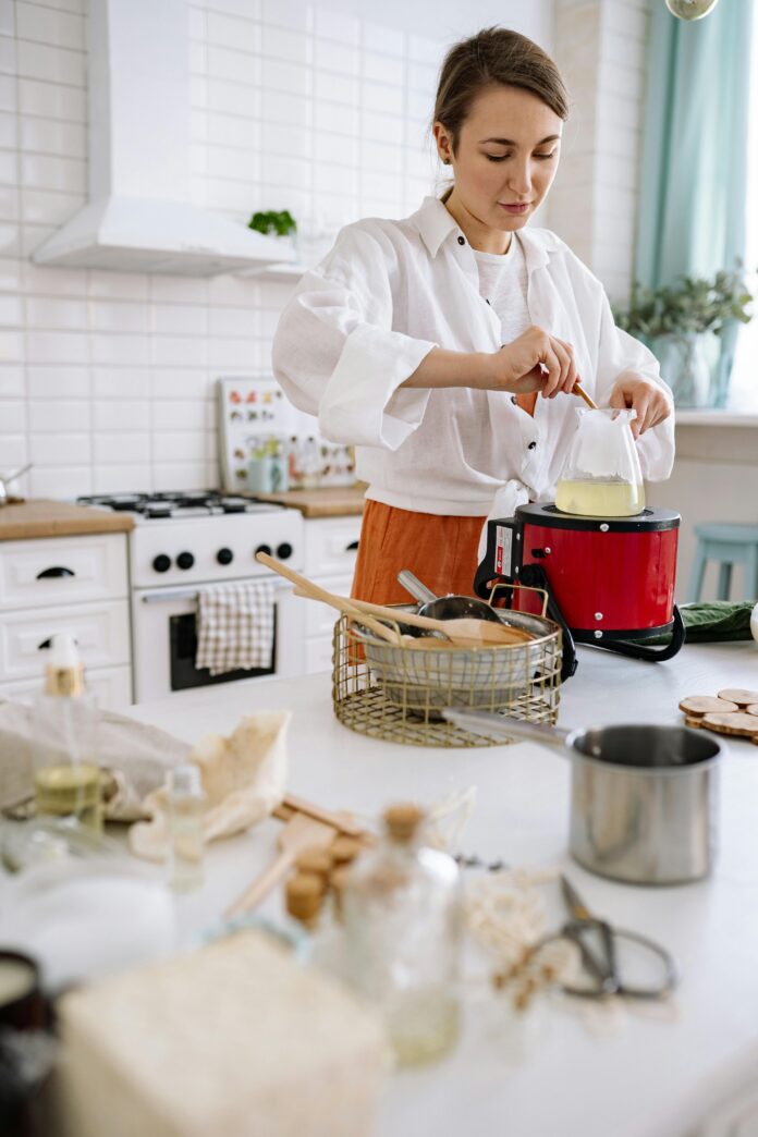 A selection of essential kitchen tools, including chef’s knife, cutting board, mixing bowls, and measuring cups, displayed on a countertop.