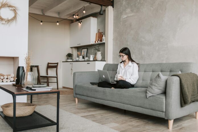 A modern smart home featuring automated lighting, a voice-controlled assistant, and energy-efficient devices seamlessly integrated into the living space.