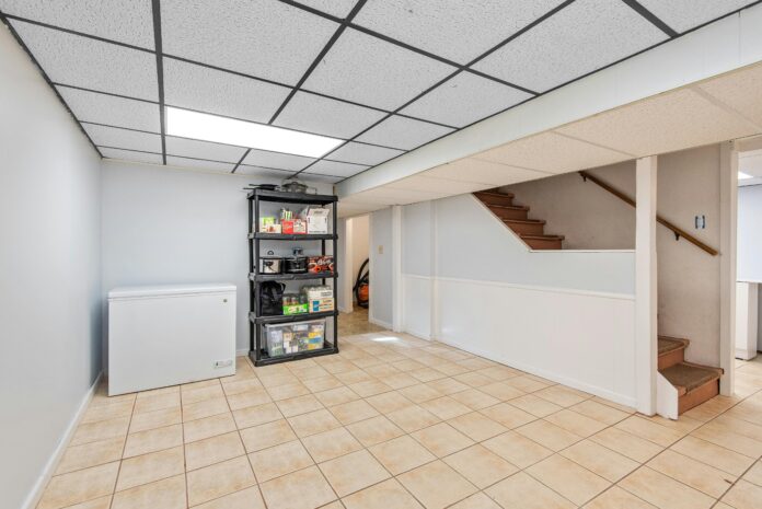 basement with waterproofing systems, sump pump installation, and proper drainage to illustrate basement flooding prevention techniques.