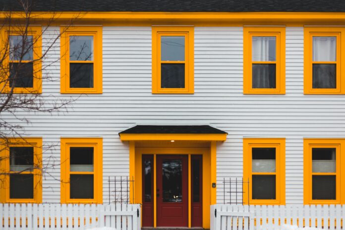 Modern home with stylish siding, showcasing enhanced curb appeal with vibrant exterior finishes