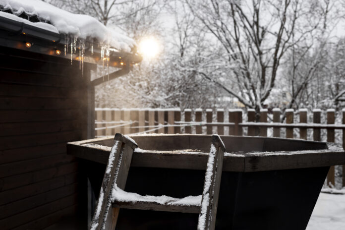 Illustration showing how ice dams form in gutters and effective prevention tips.