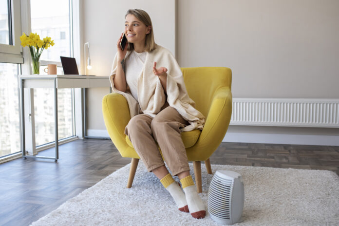 Modern air purifier in a living room, designed to reduce asthma triggers like dust and pollen.