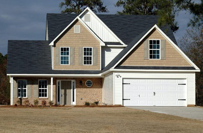 Comparison between an attached garage connected to a home and a detached garage with a spacious driveway.