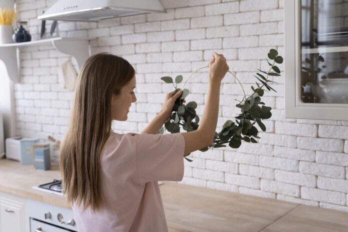 A beautifully designed eco-friendly kitchen remodel featuring sustainable materials, energy-efficient appliances, bamboo cabinets, and a stylish green backsplash.