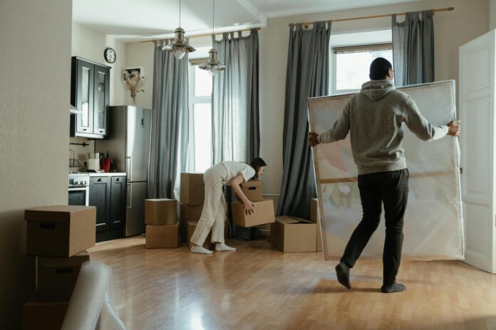 A family enjoying a newly added living room space designed to accommodate their growing needs.