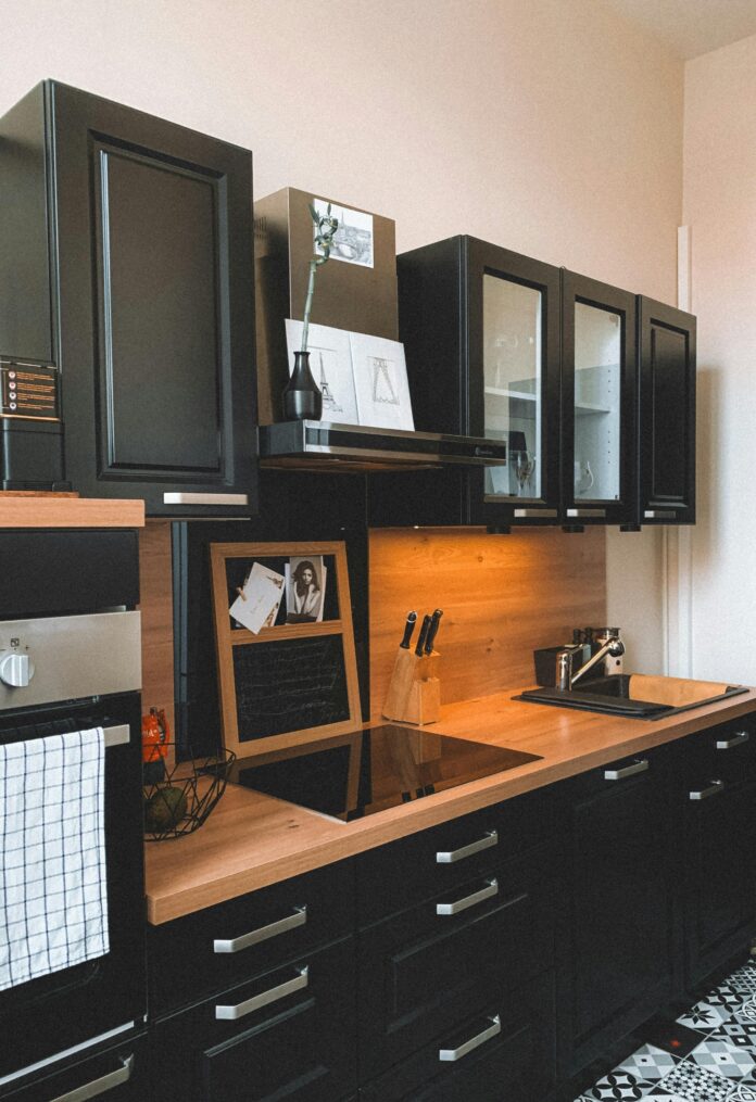 Modern kitchen featuring creative storage ideas, including open shelving, pull-out cabinets, and vertical storage solutions for an organized space.